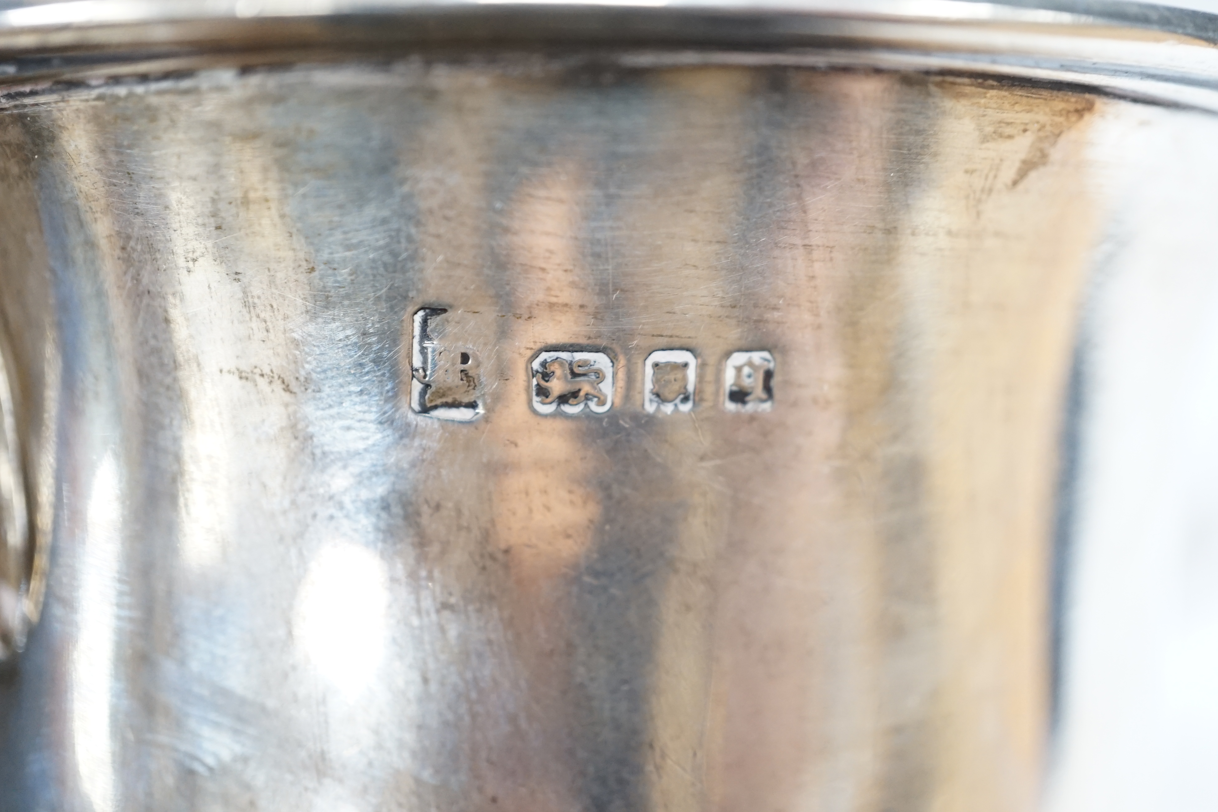 A George III engraved silver helmet shaped cream jug, John Eames, London, 1798, 11.1cm, a Japanese Suzuyo 950 white metal two handled shallow bowl, a George V silver two handled presentation trophy cup and a silver circu